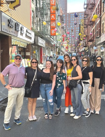 RoseComm team standing in Chinatown in New York City