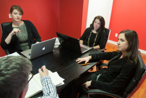 Members of the RoseComm team during a meeting with a client / Photo by Joe Epstein 