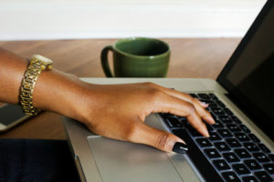 black-woman-hand-on-laptop-createherstock picmonkey