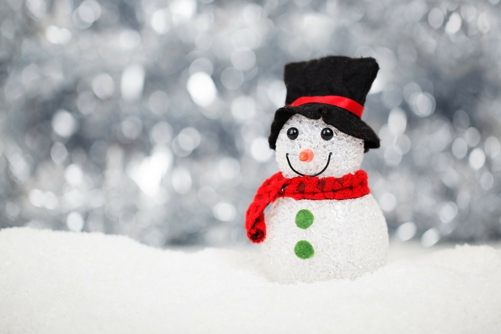 Holiday snowman in the snow - free winter Christmas stock photo