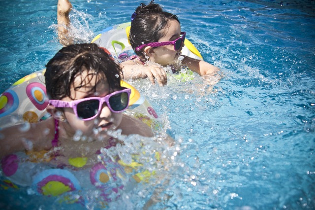 little kids swimming - free summer stock photo