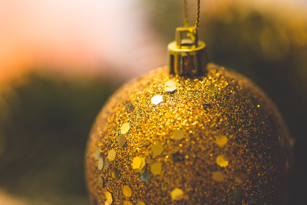 gold christmas tree ornament - free winter holiday stock photo